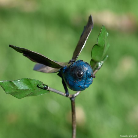 Oiseau couleur + feuilles sur tuteur