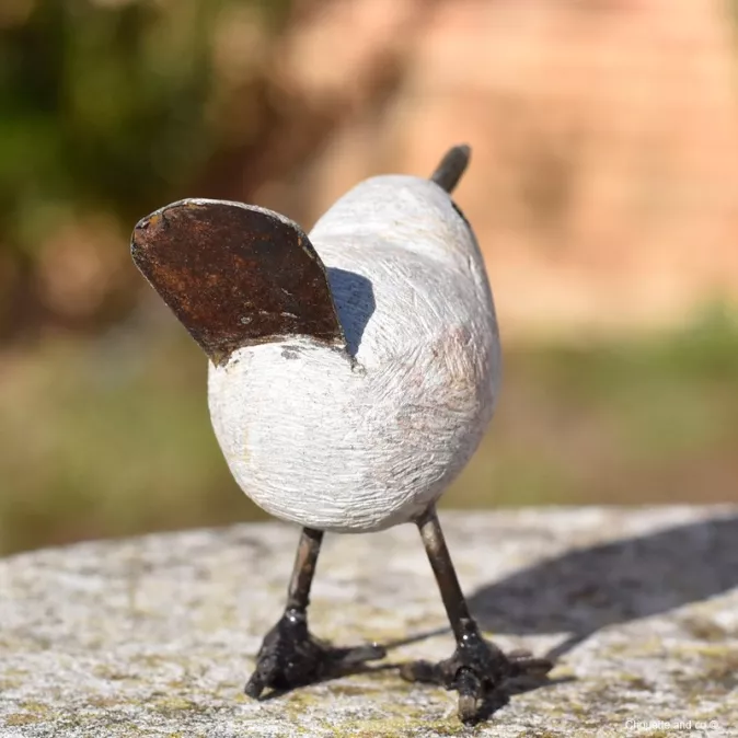 Oiseau pierre et métal