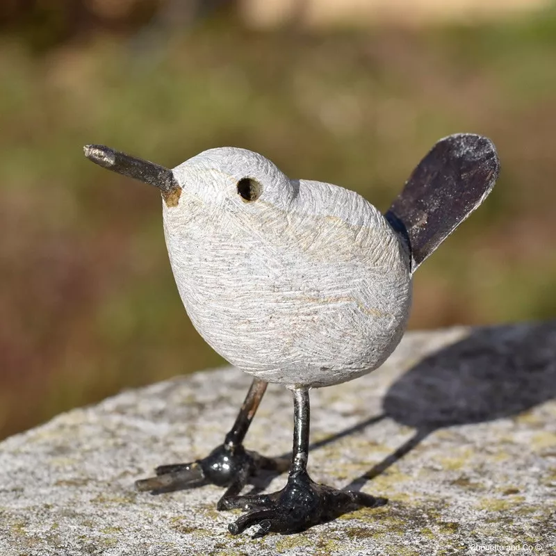 Oiseau pierre et métal