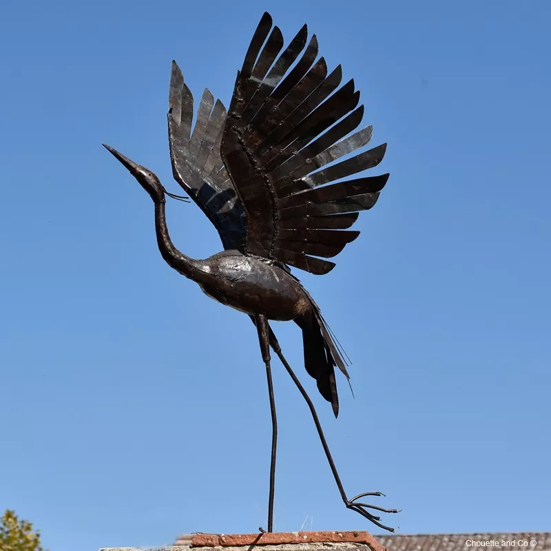 Héron ailes ouvertes